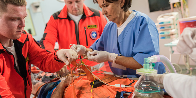 Emergency room doctors treating patient