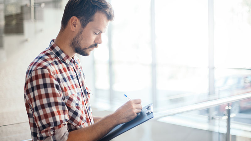 man with a clipboard