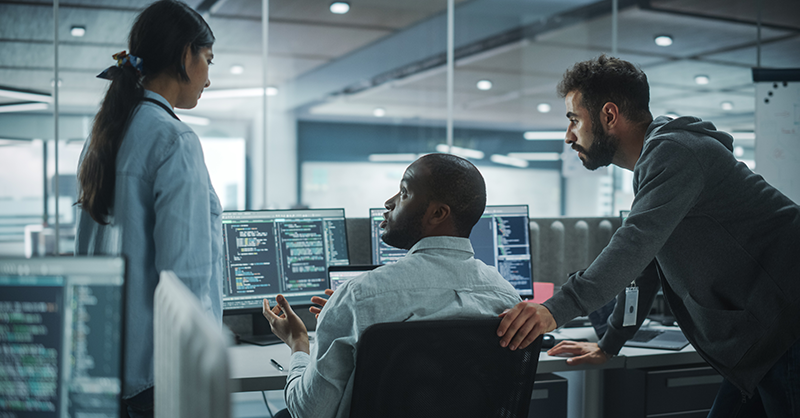 Cybersecurity team working together to address common concerns