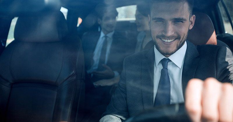Male driving a couple ride sharing