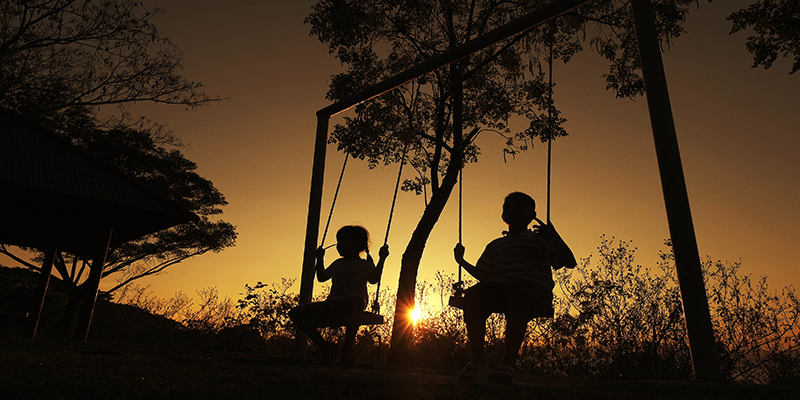 Children playing on swings