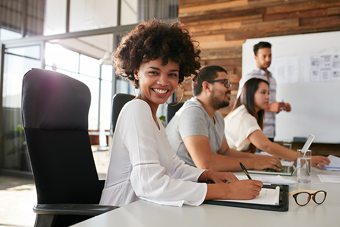 AdobeStock_380942030 Early career insurance professional working at copier