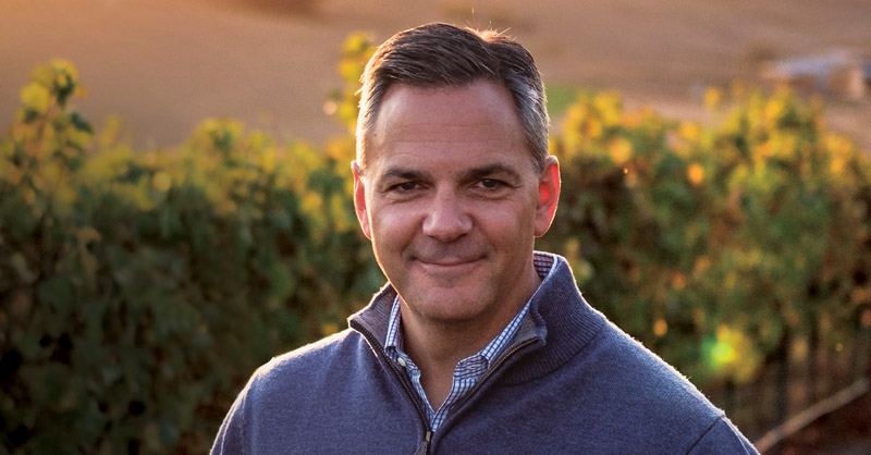 Larry Chasin portrait outside in wine field