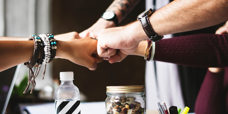 Group of millenials fist pump - Photo by rawpixel.com on Unsplash
