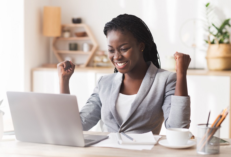 Businesswoman Celebrating Success At Workplace